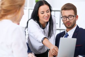 woman showing benefits to coworker